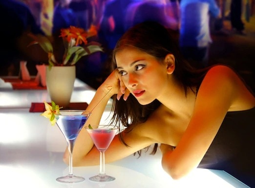pensive woman at bar